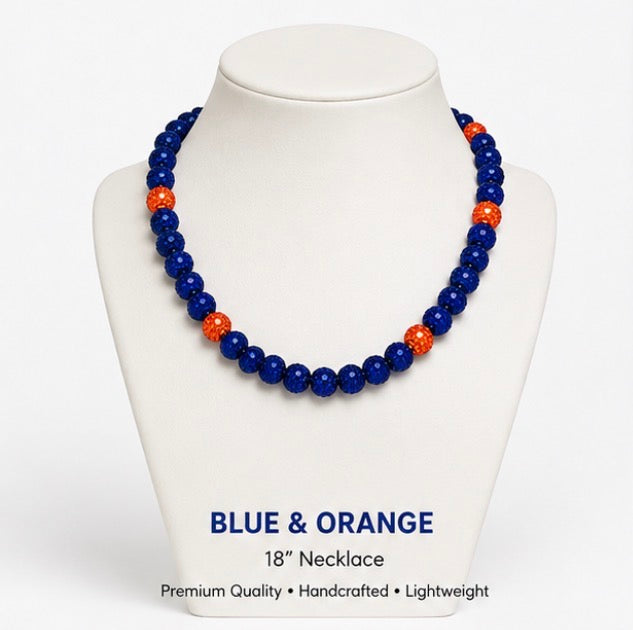 Blue and Orange rhinestone baseball necklace on display stand
