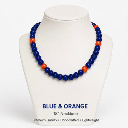 Blue and Orange rhinestone baseball necklace on display stand